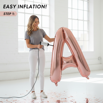 Person inflating rose gold 40-inch foil letter balloon with pump