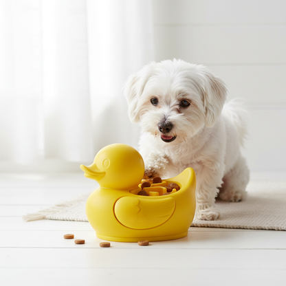 Small dog playing with a duck-shaped puzzle slow feeder bowl